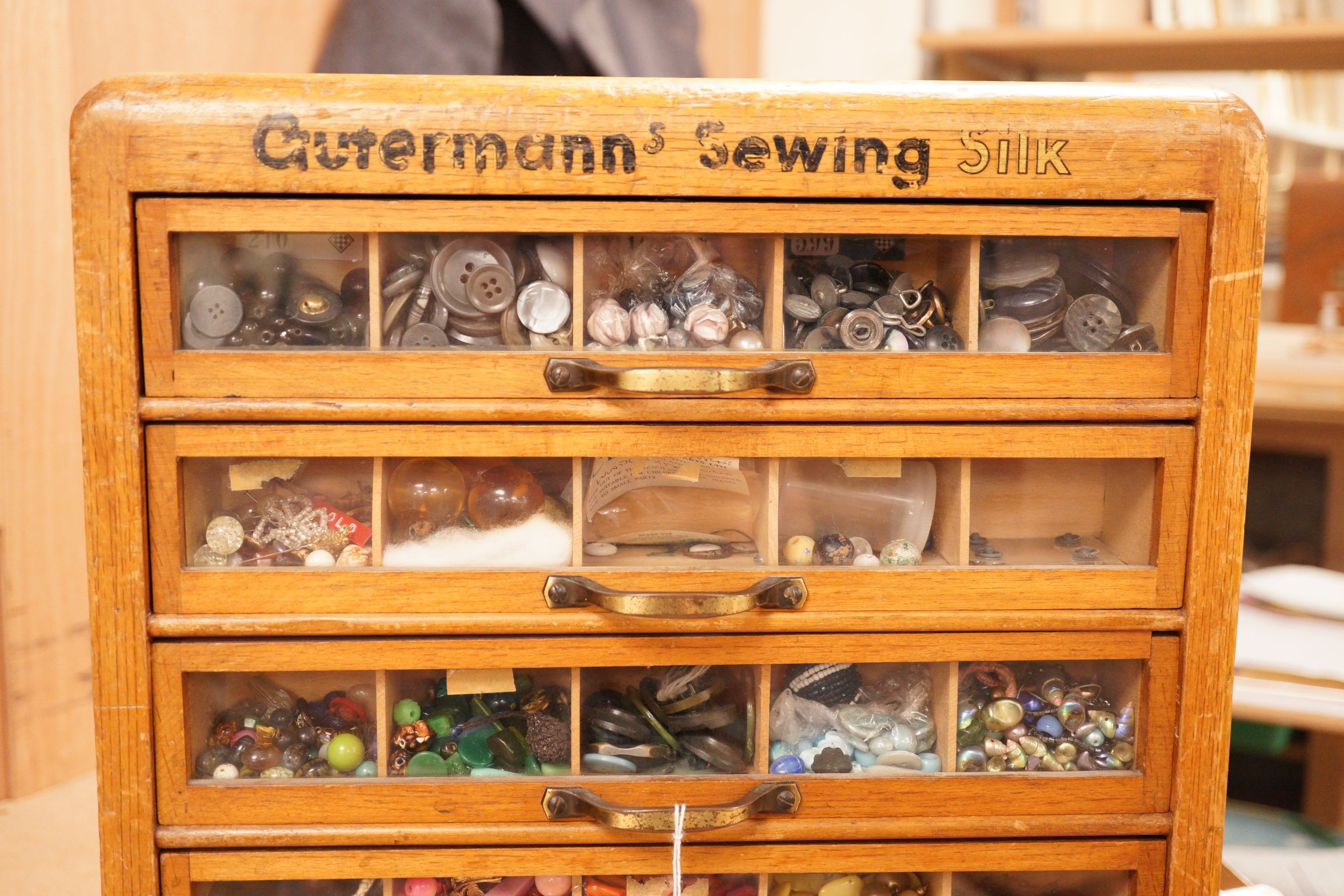 A 'Gutermann's Sewing Silk' merchants display case with contents